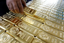 Gold off record high amid US rate cut hopes